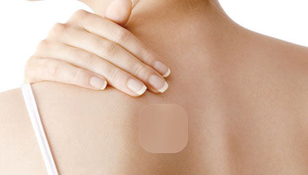 CBD Patches for Back Pain: Targeted Relief for Your Lower Back — Woman with tattoo on lower back | Purity Hemp Naturals